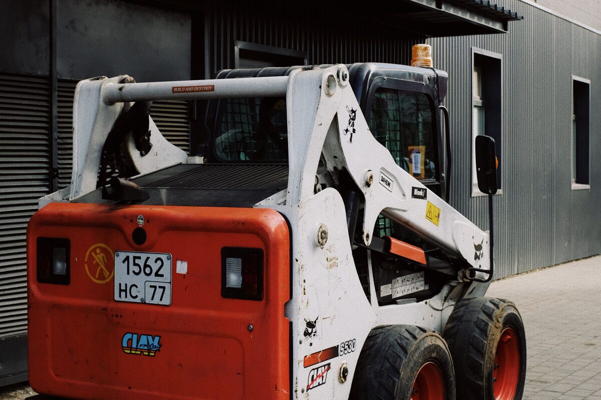 Compact loader at a commercial work site